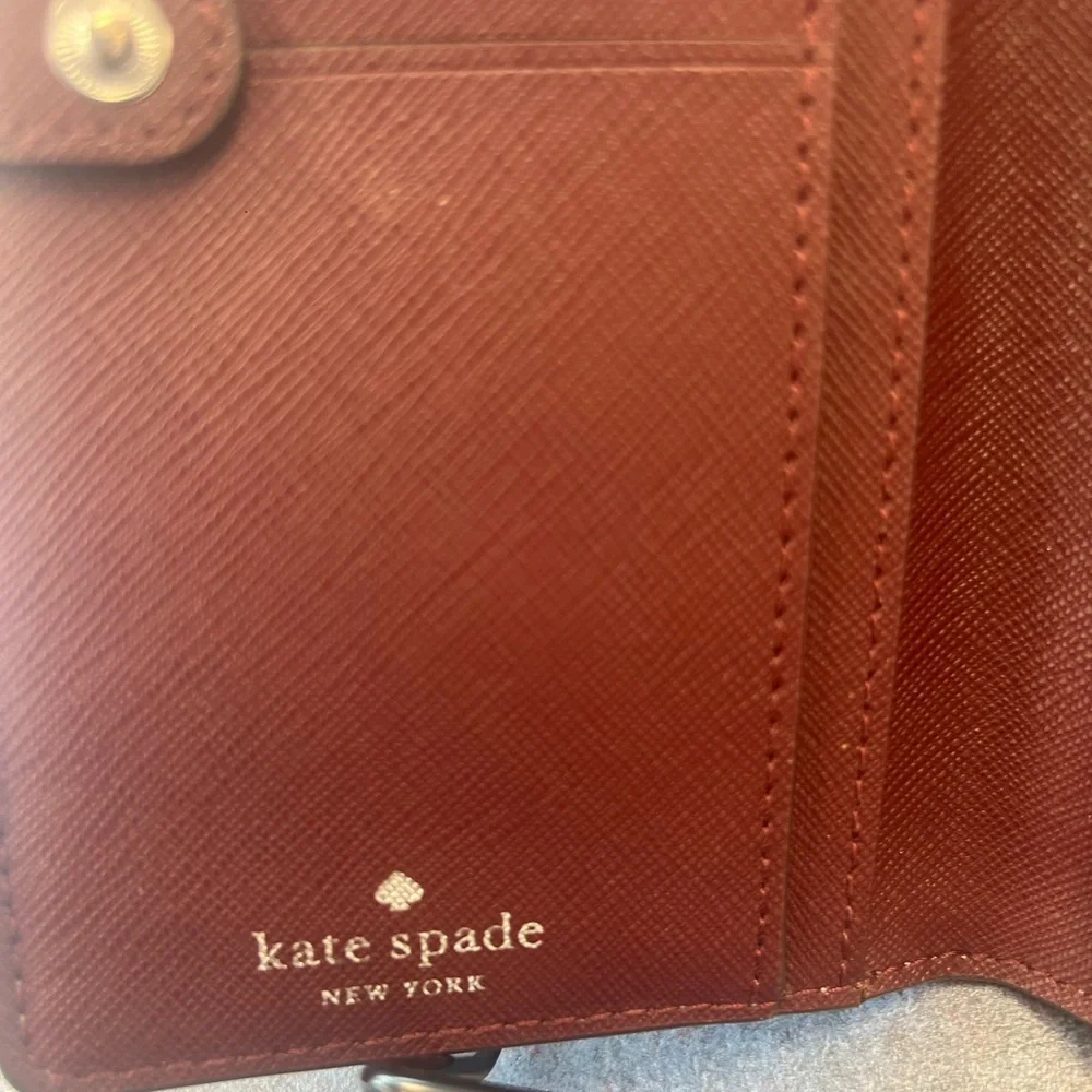 Kate spade Gray with red interior Leather Wallet